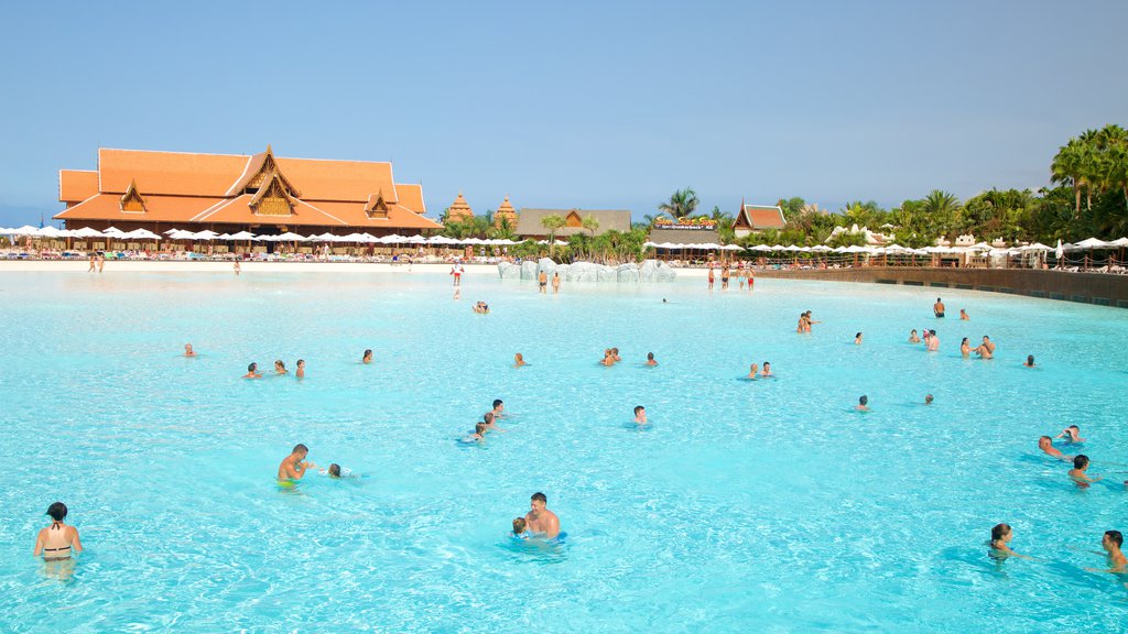 Siam Park featuring swimming and a waterpark as well as a large group of people