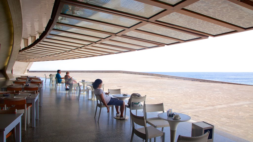 Auditorio de Tenerife showing general coastal views and café lifestyle as well as a couple