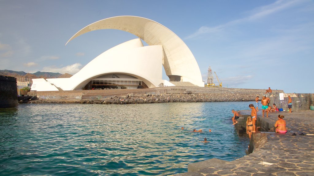 Auditorio de Tenerife showing general coastal views, modern architecture and swimming