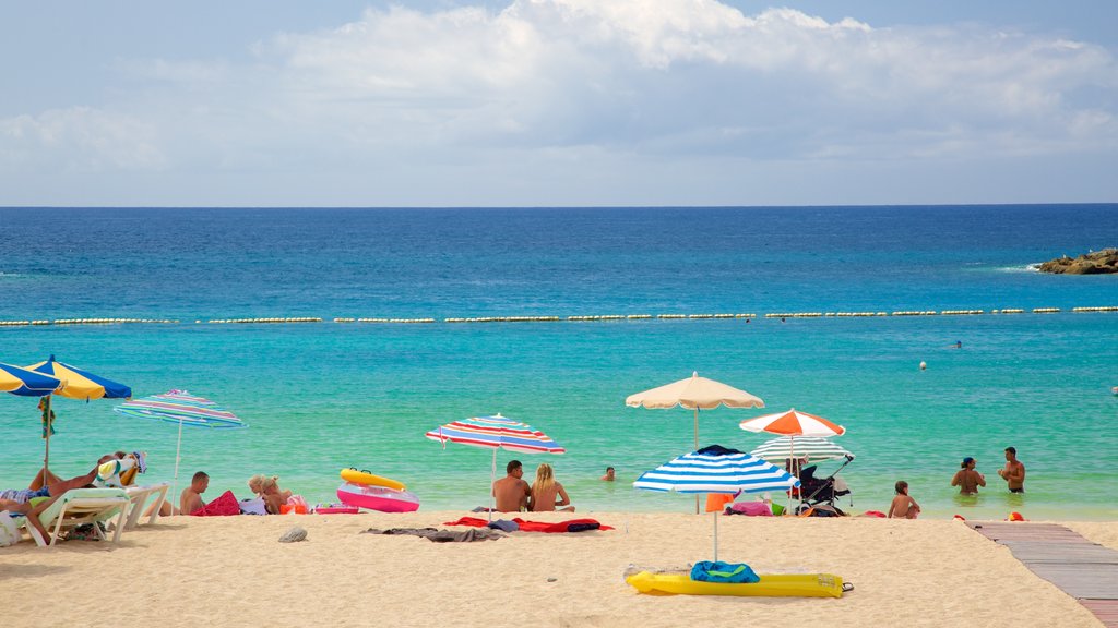 Amadores Beach which includes a sandy beach, swimming and general coastal views