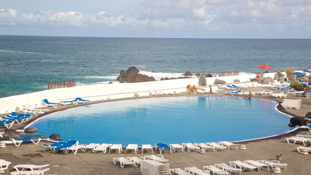 Lago Martianez Swimming Pools showing a pool and a luxury hotel or resort