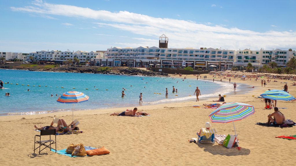 Las Cucharas Beach showing a coastal town, a beach and general coastal views