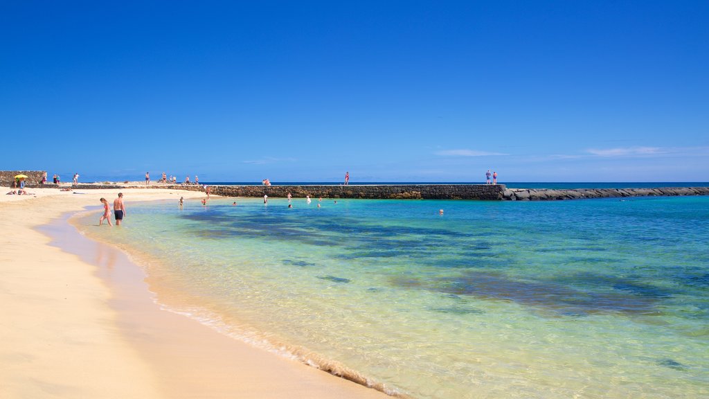 Las Cucharas strand som inkluderar en sandstrand och kustutsikter