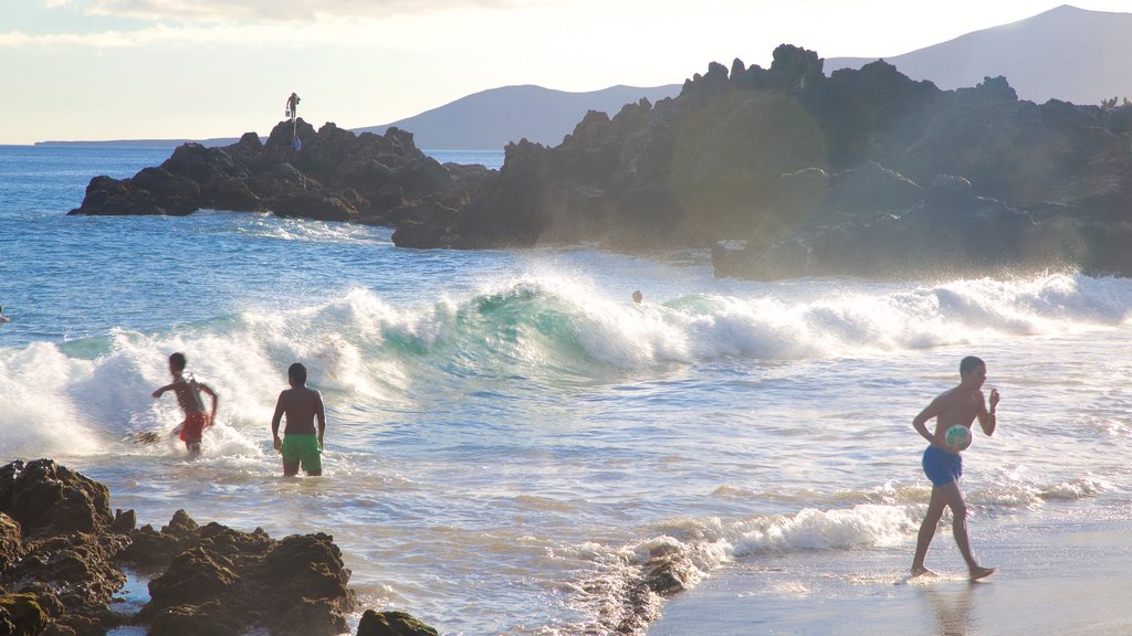 Puerto del Carmen featuring a sandy beach, general coastal views and surf