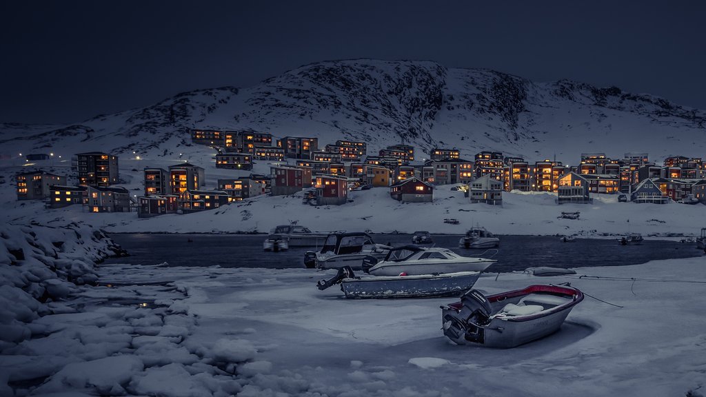 Nuuk which includes mountains, night scenes and boating