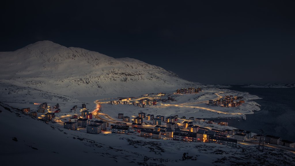 Nuuk which includes mountains, a city and night scenes