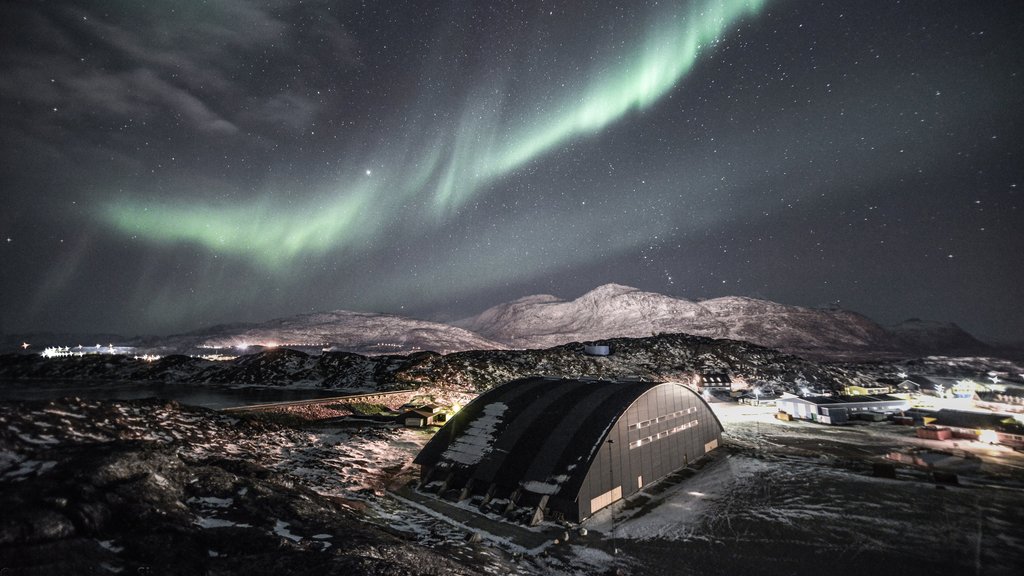 Nuuk which includes mountains, northern lights and a city