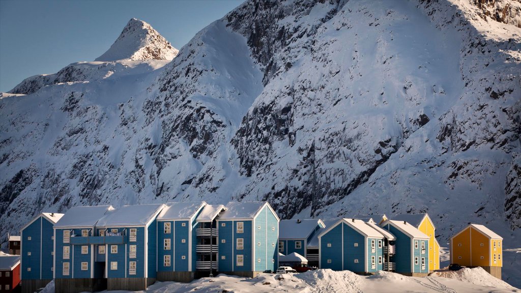 Sisimiut which includes a small town or village, snow and mountains