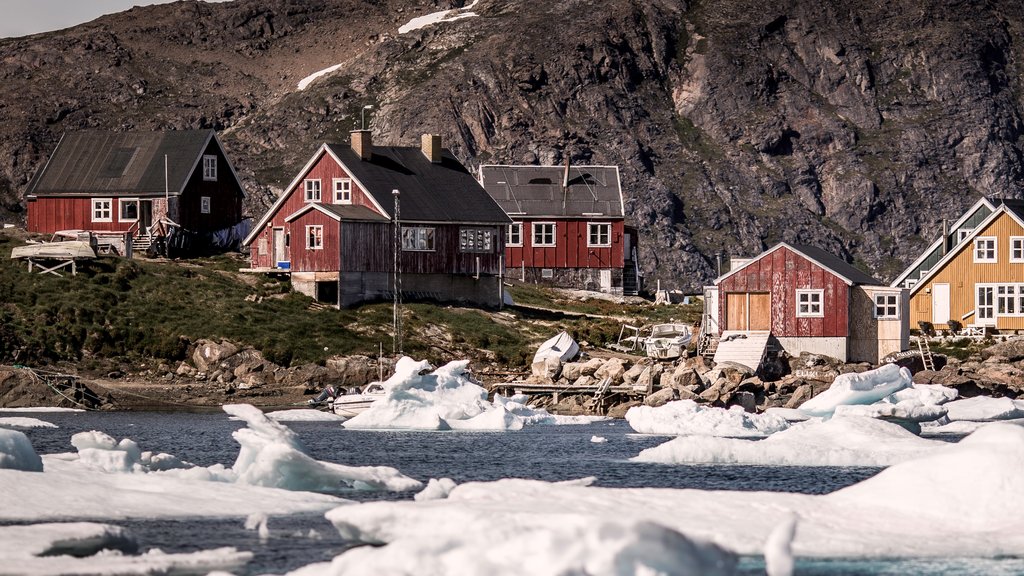 Kulusuk featuring mountains, a small town or village and a lake or waterhole