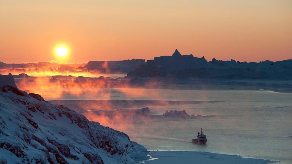 Greenland which includes a sunset, mountains and general coastal views