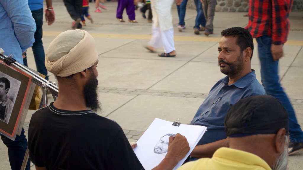 Sukhna Lake featuring art as well as a small group of people