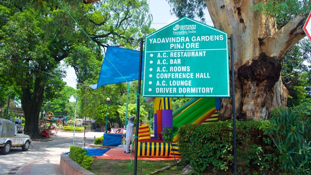 Yadavindra Gardens featuring a garden and signage