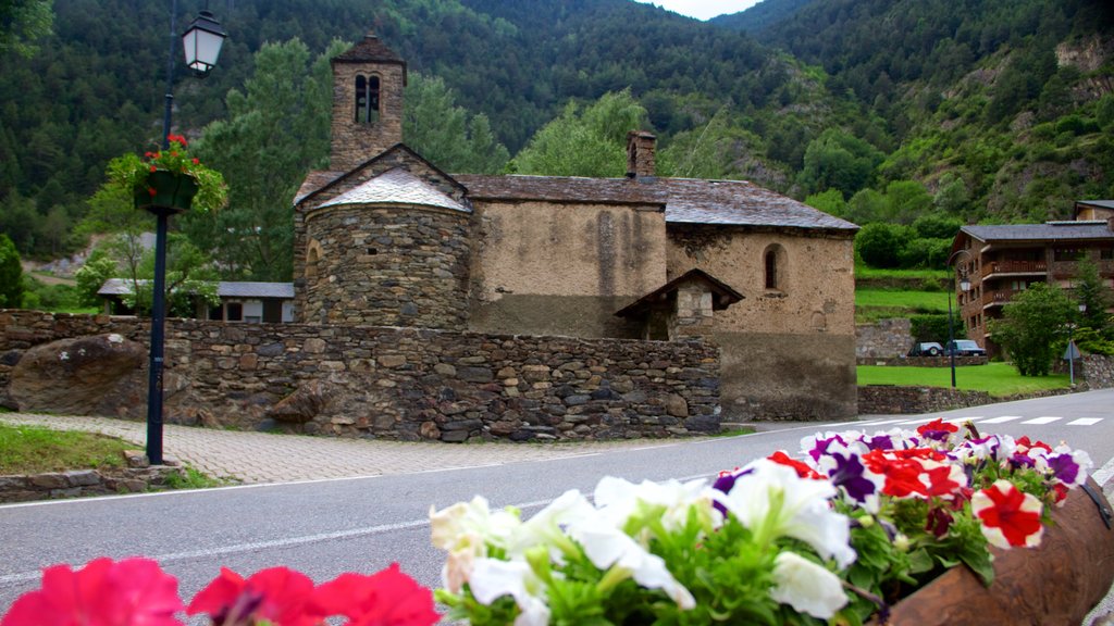 La Cortinada which includes heritage architecture, a house and flowers