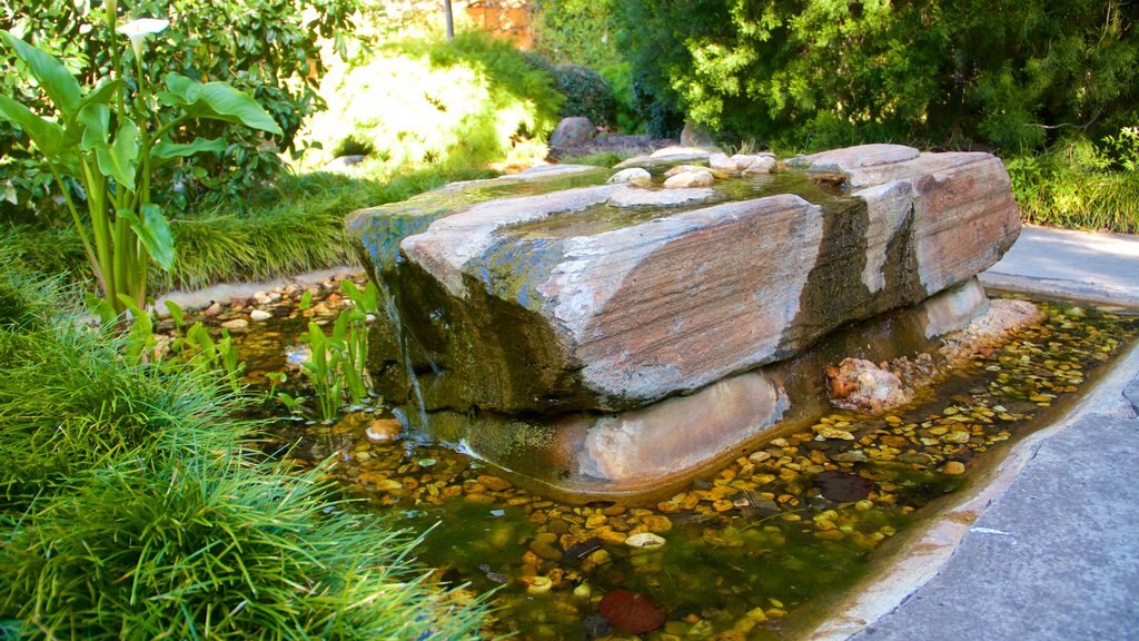 Himeji Gardens which includes a fountain and a park