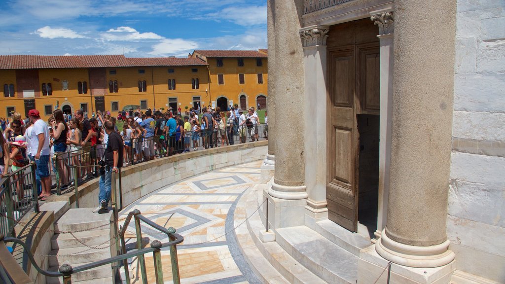 Leaning Tower showing heritage architecture as well as a large group of people