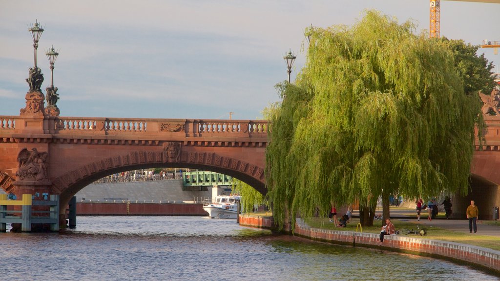 Berlin showing a bridge and a lake or waterhole