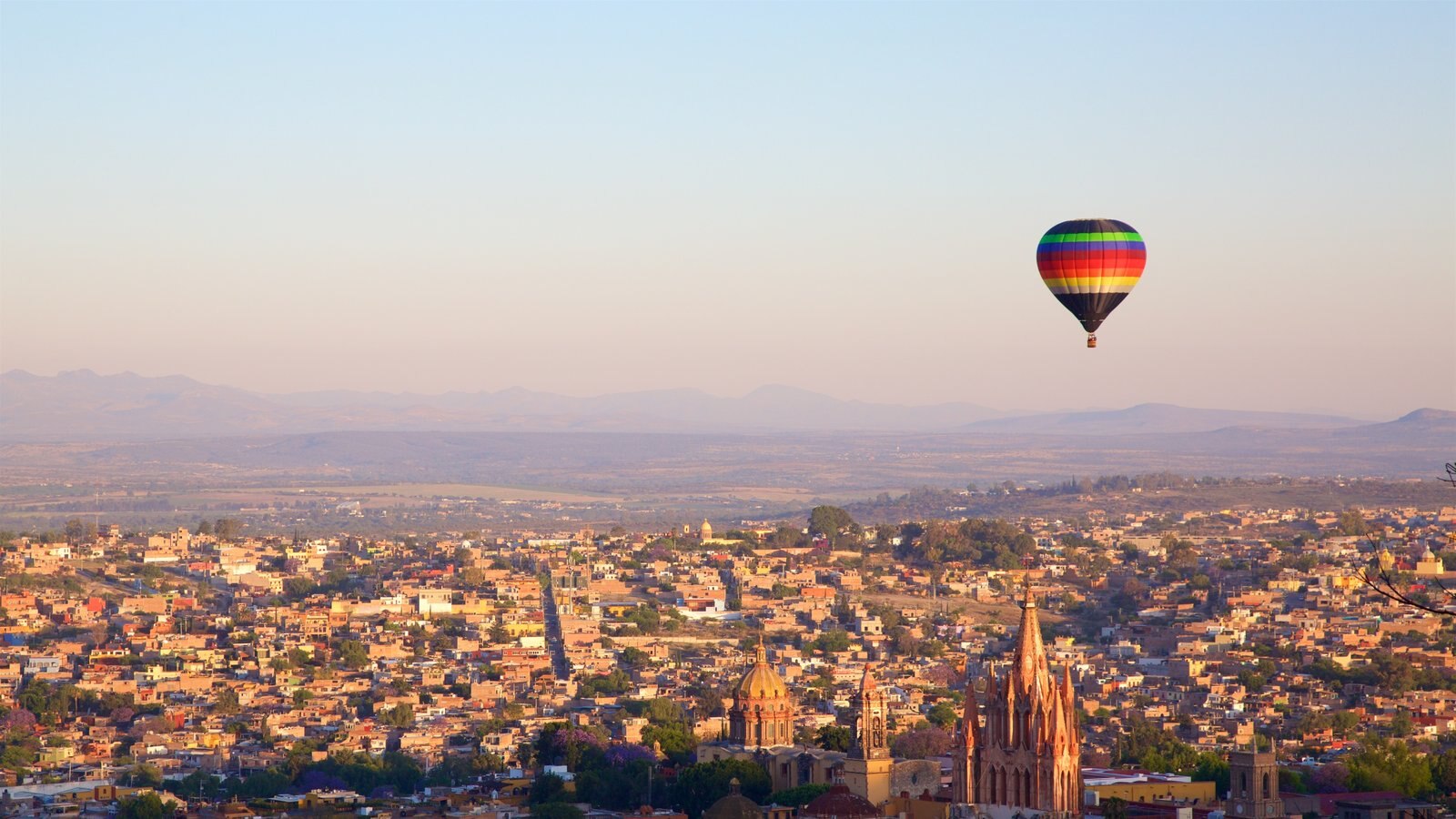 Mexico featuring ballooning, tranquil scenes and a sunset
