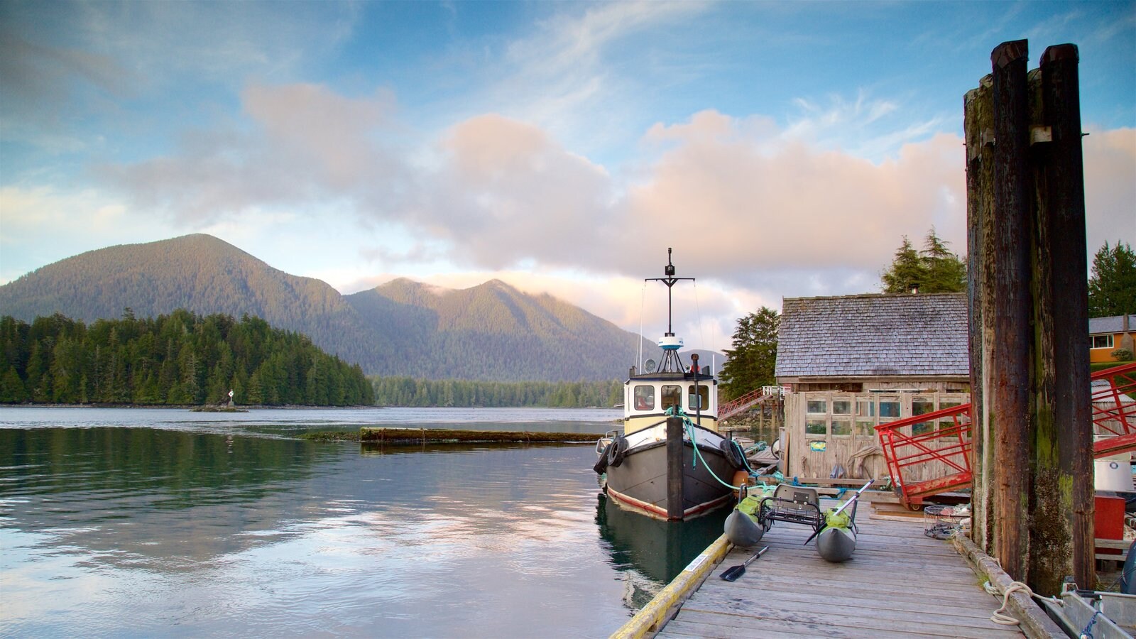 Tofino which includes a lake or waterhole, tranquil scenes and a sunset