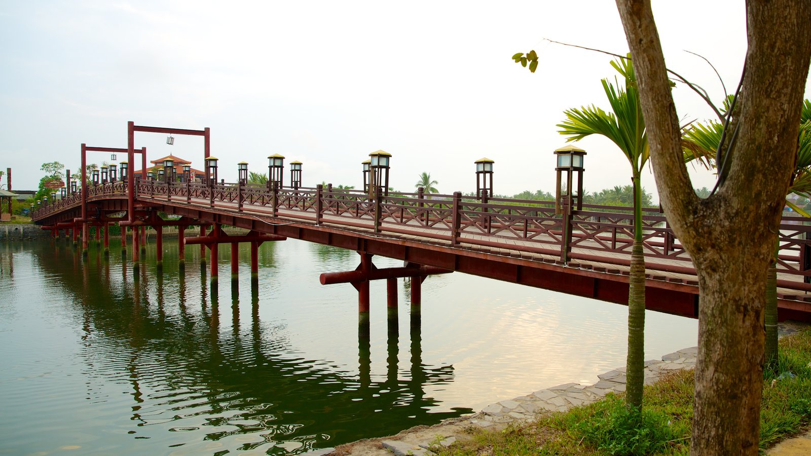 Hoi An which includes a river or creek, a bridge and a park