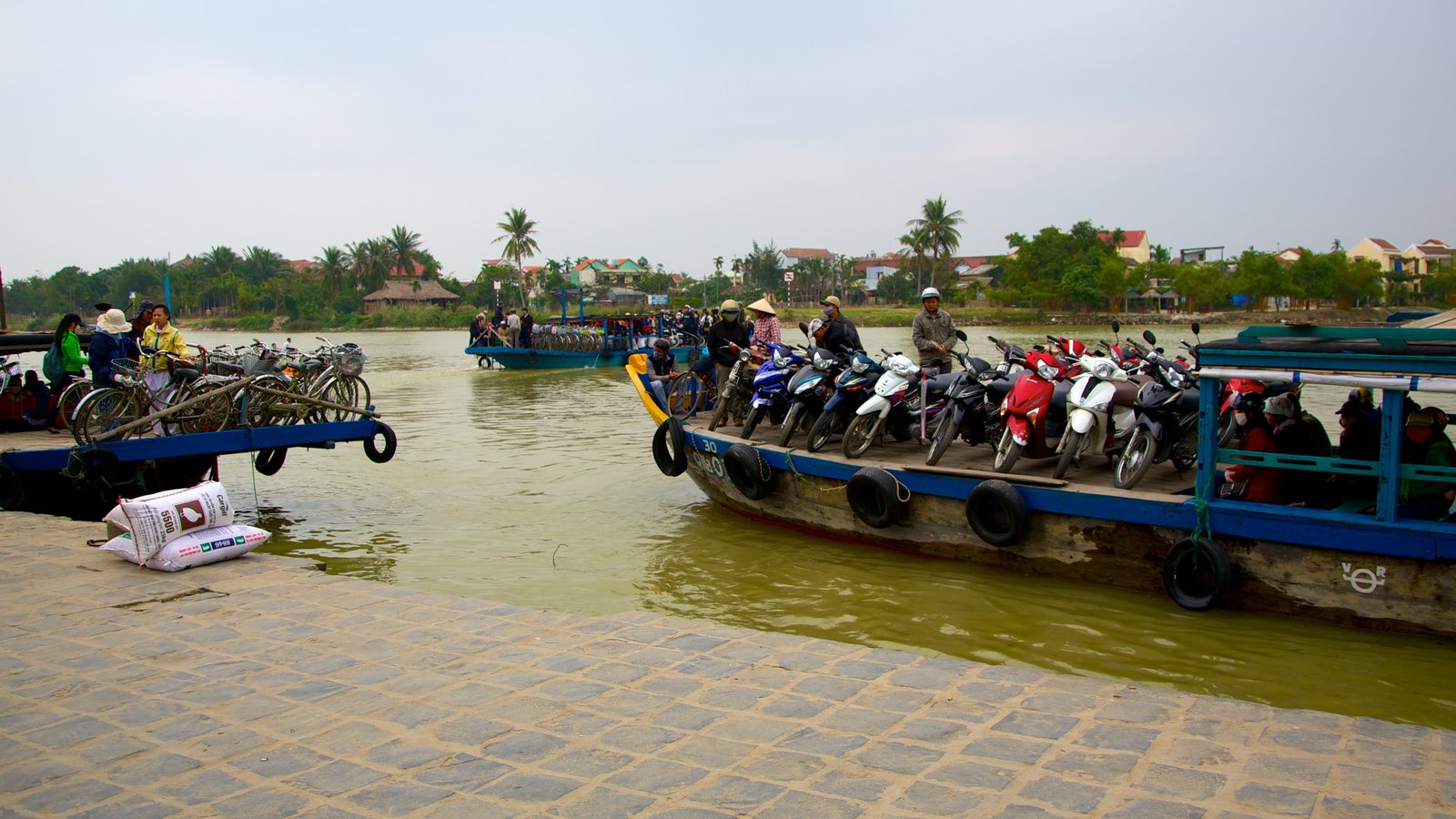 Hoi An featuring boating, a bay or harbour and a river or creek