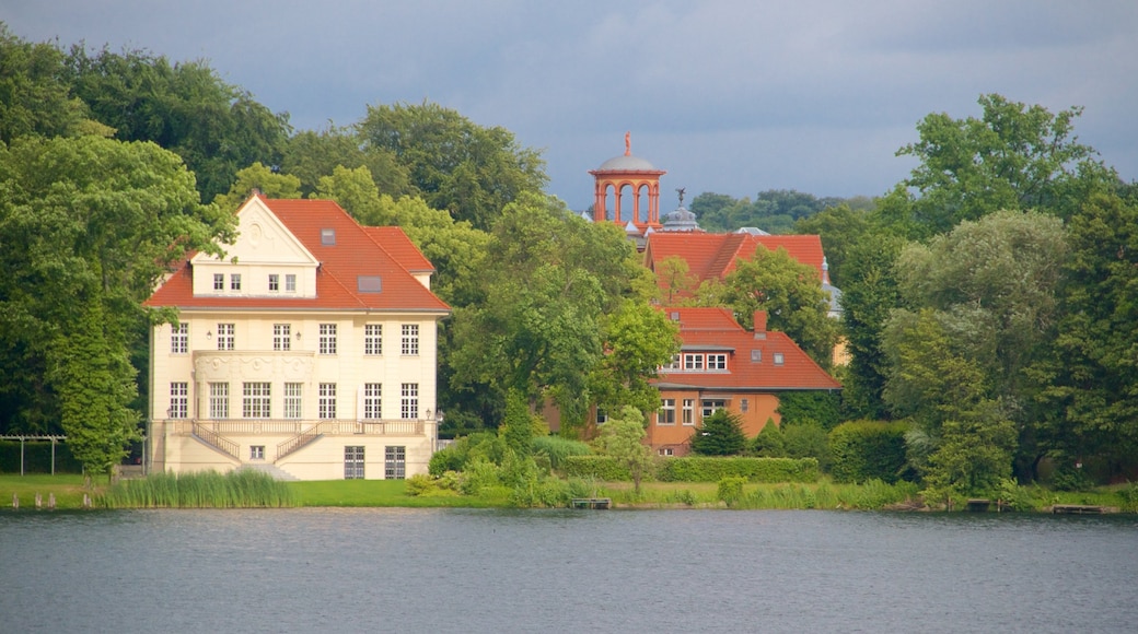 Potsdam featuring a lake or waterhole, heritage architecture and a house