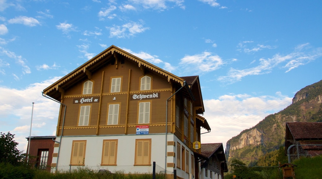 Bernese Alps showing signage and a house