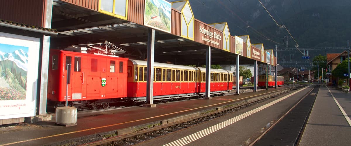 Wilderswil showing mountains, railway items and signage