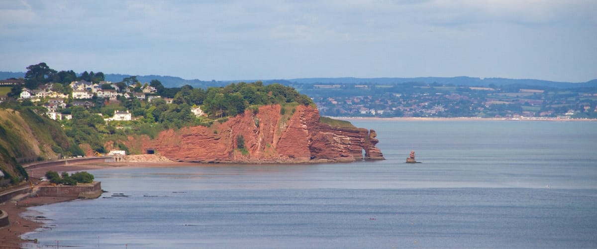 Teignmouth featuring a coastal town, a beach and general coastal views