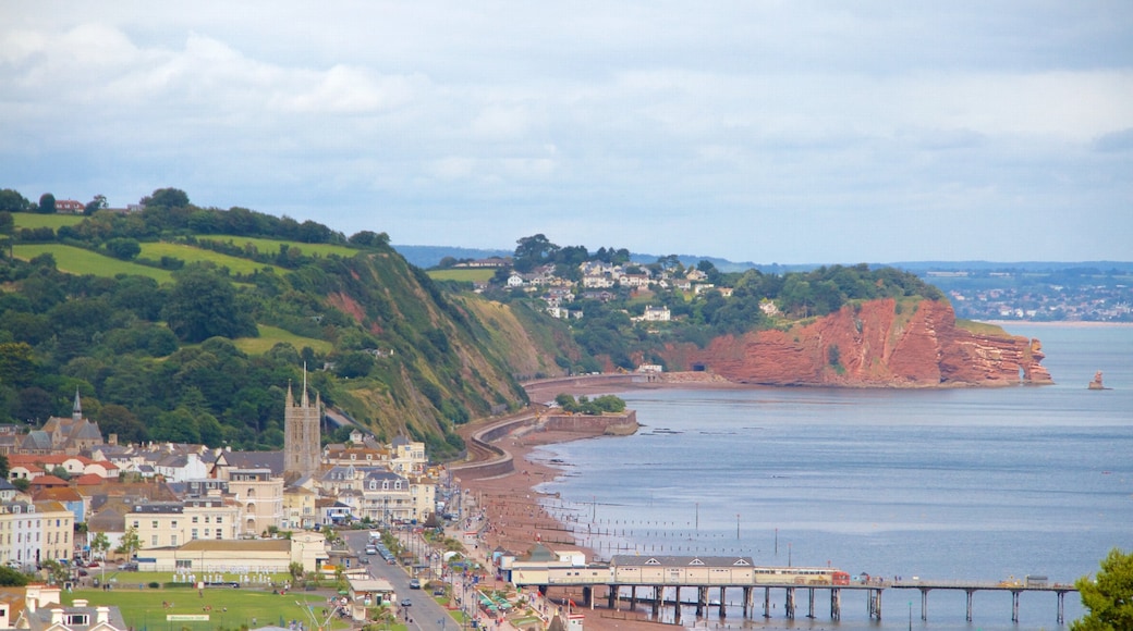 Teignmouth which includes a coastal town, a sandy beach and a bridge