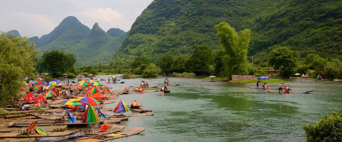 Yangshuo which includes a river or creek and mountains