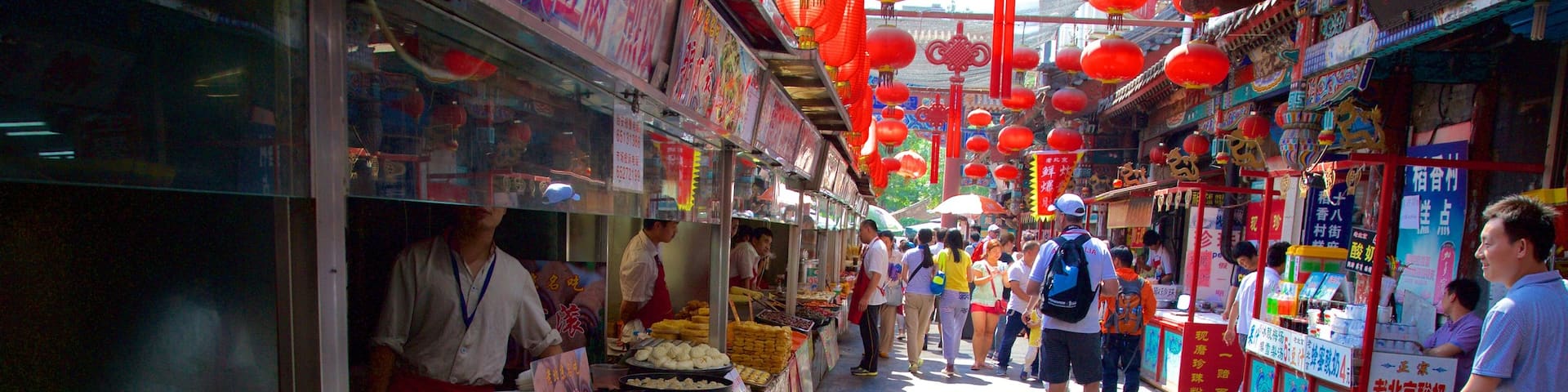 Wangfujing Street featuring markets as well as a small group of people