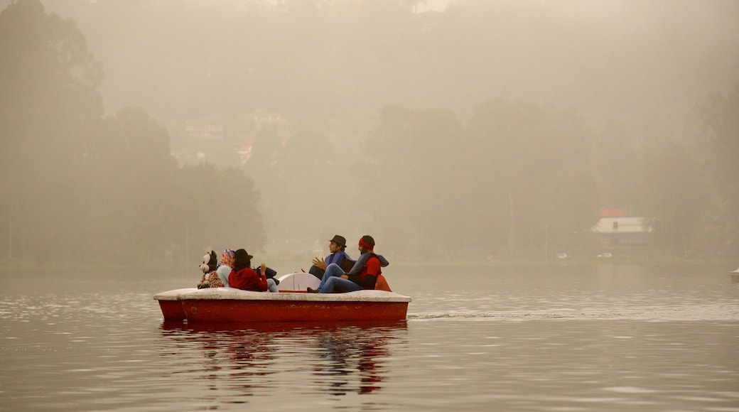 Kodaikanal showing a lake or waterhole and water sports as well as a small group of people