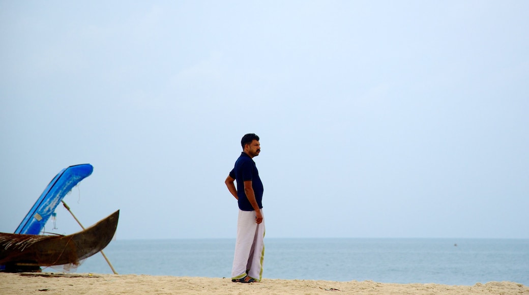 Marari Beach showing a sandy beach as well as an individual male