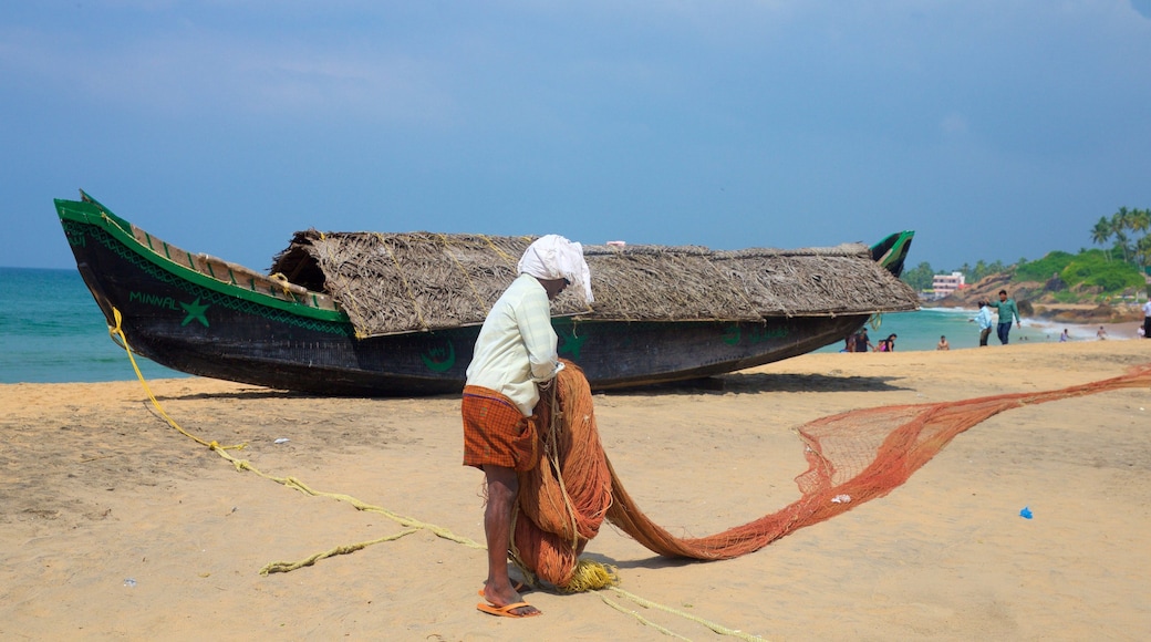 Kovalam Beach featuring a beach as well as an individual male