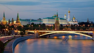 Moscow Kremlin which includes a river or creek, night scenes and a city