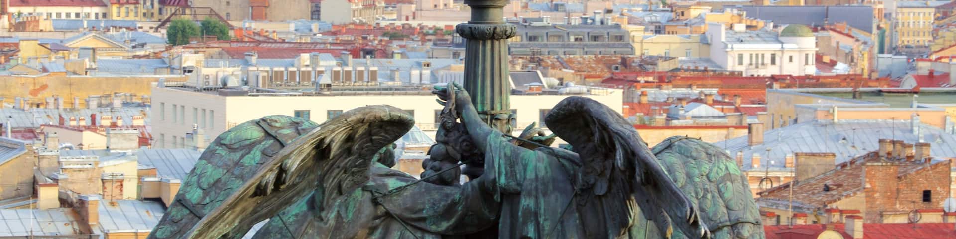 St. Isaac\'s Cathedral showing a statue or sculpture and a city