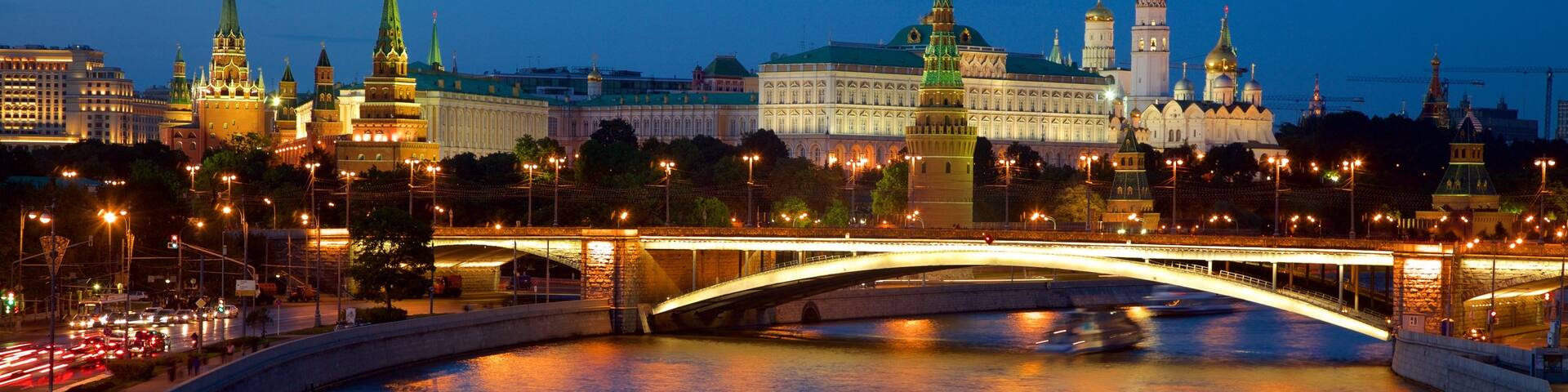 Moscow Kremlin featuring night scenes, a ferry and a river or creek