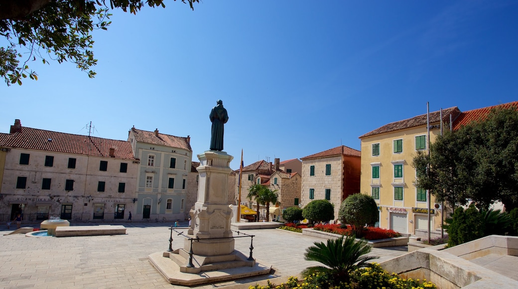 Makarska which includes a square or plaza and a statue or sculpture