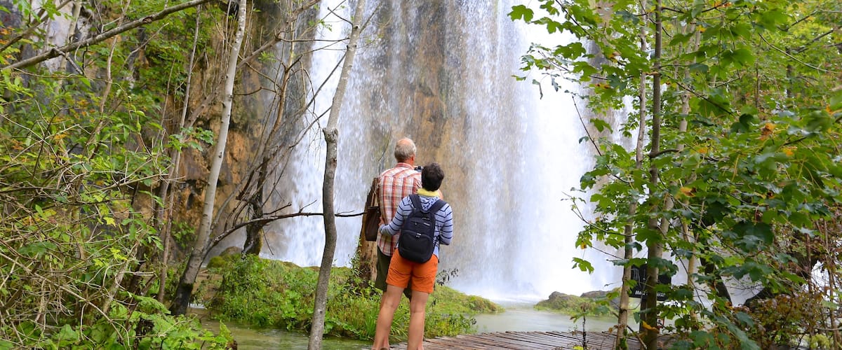 Plitvice Lakes National Park - Entrance 1 featuring hiking or walking and a waterfall