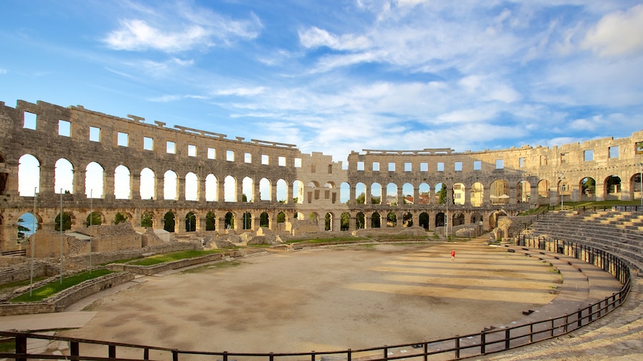 Pula Arena which includes heritage elements, building ruins and a monument
