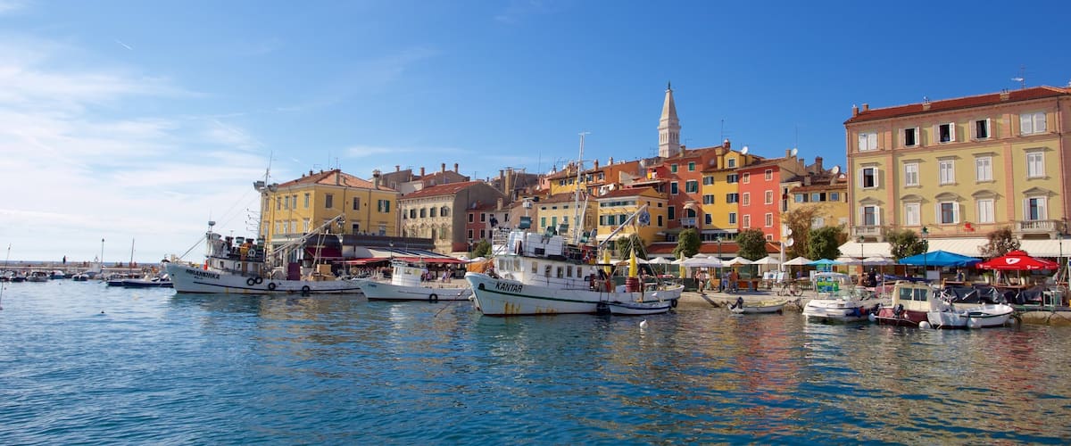 Rovinj Harbour featuring a bay or harbor, boating and a coastal town