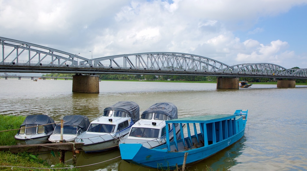 Truongtien Bridge which includes boating, a bridge and a river or creek