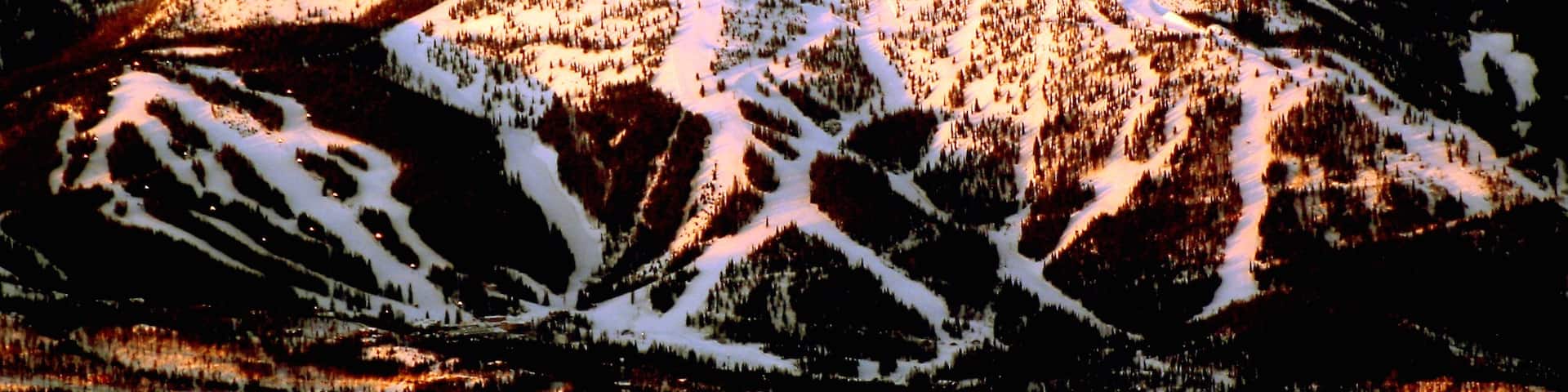 Montana which includes snow, mountains and a sunset