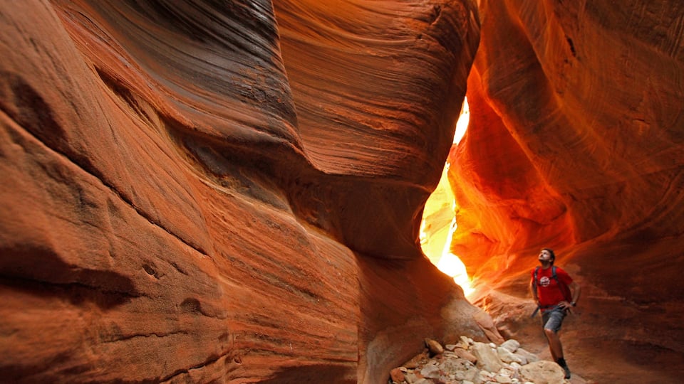 St. George featuring a gorge or canyon and climbing as well as an individual male
