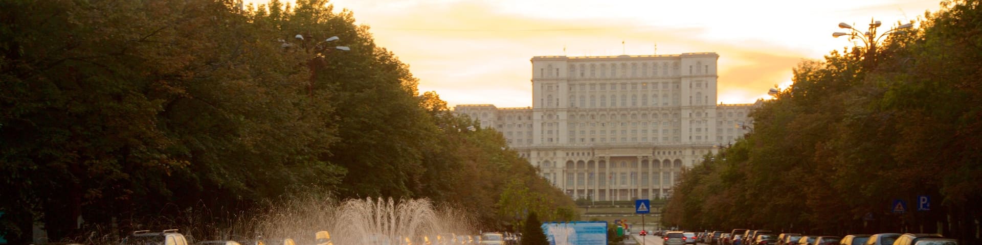 Palace of the Parliament featuring a fountain, street scenes and heritage architecture