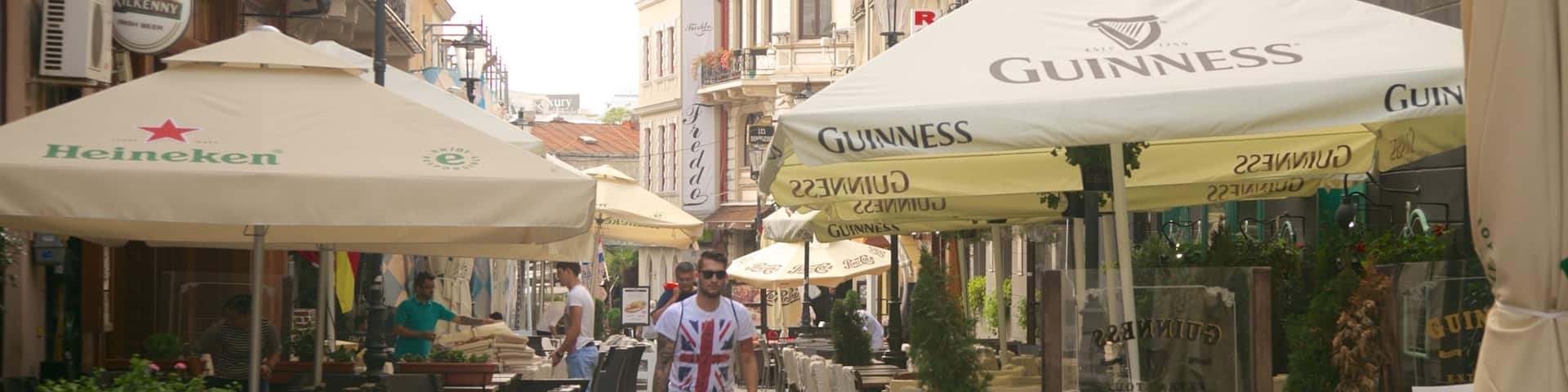 Lipscani which includes street scenes, cafe lifestyle and a city