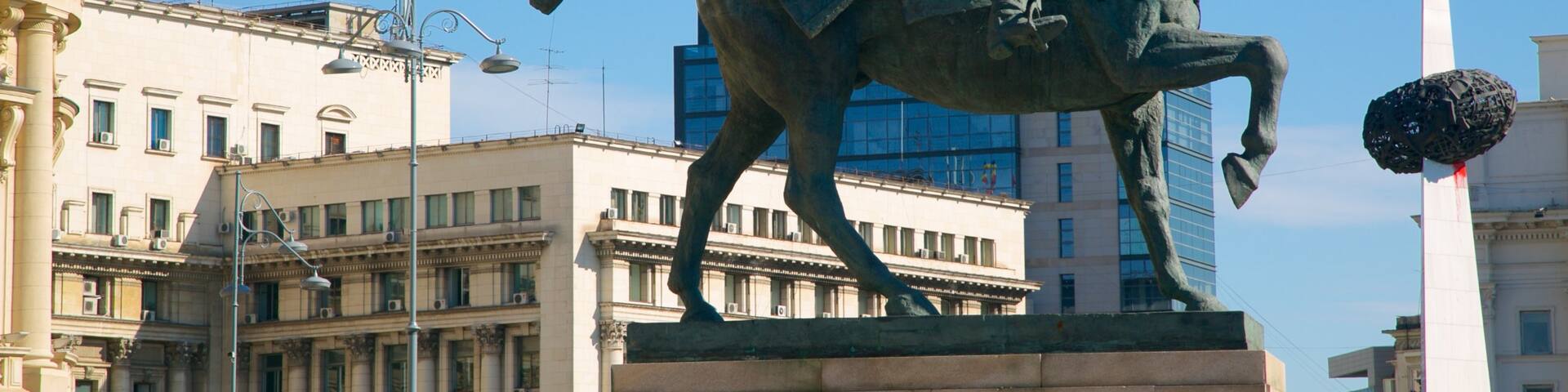 Revolution Square showing a statue or sculpture and a square or plaza