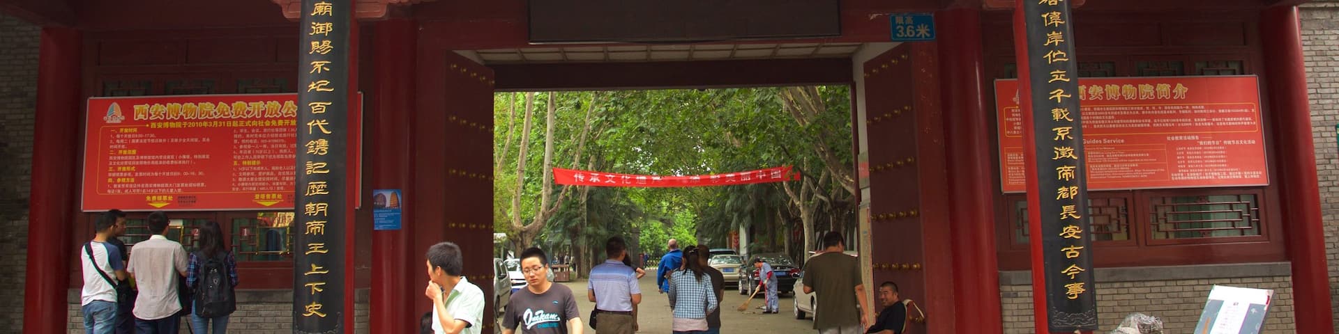 Giant Wild Goose Pagoda which includes a temple or place of worship and signage as well as a small group of people