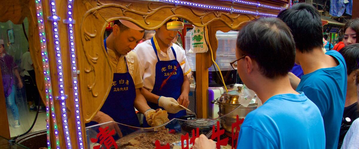 Great Mosque of Xi\'an featuring food and markets as well as a small group of people