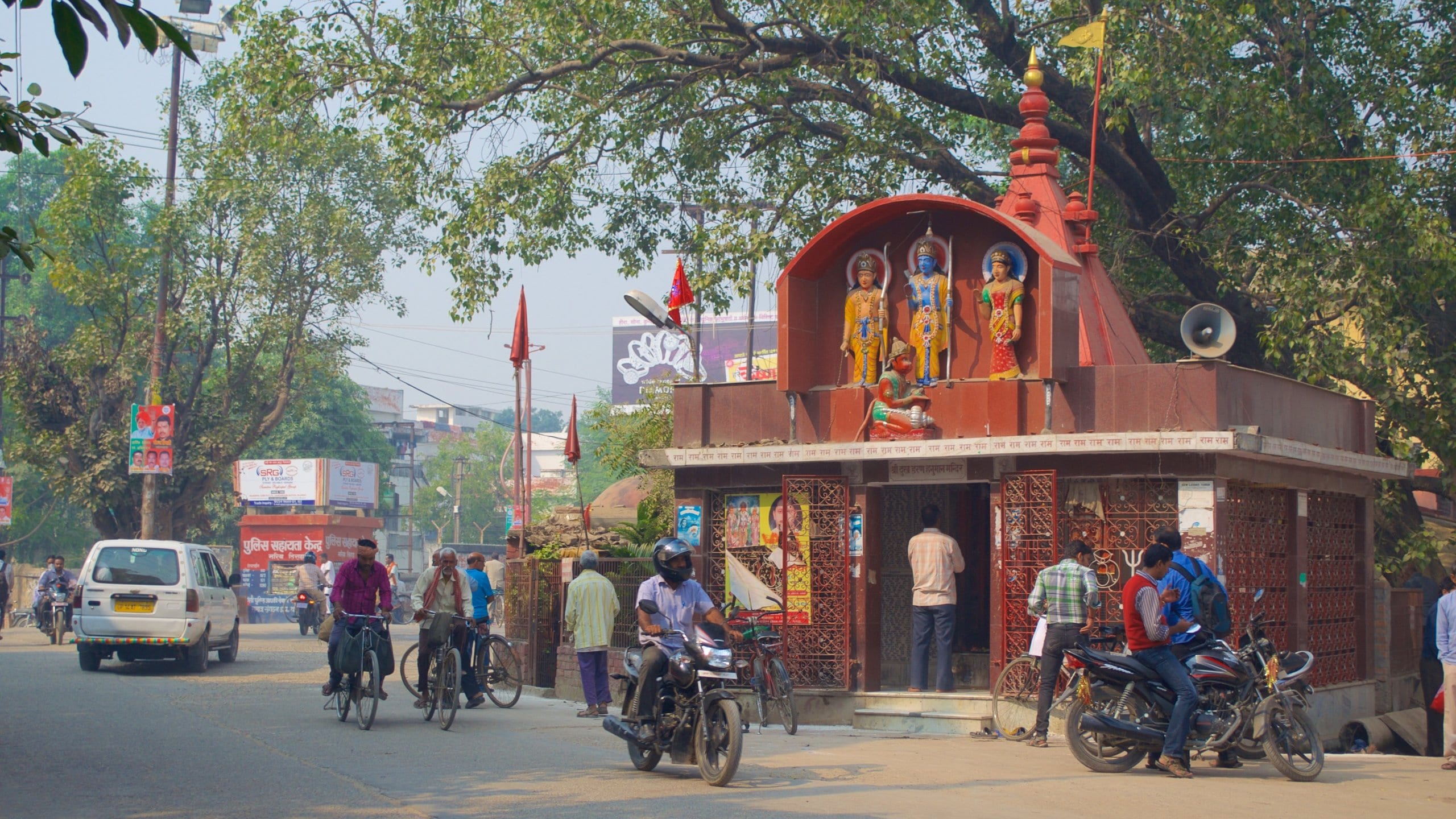 Varanasi featuring street scenes, motorbike riding and cycling